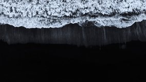Black sand beach with crashing waves, Serene and tranquil landscape, Ocean coast with calm waves, Famous landmark of Iceland, Black sand of volcanic origin aerial view - Powered by Shutterstock - Get 15% off with code: PIKWIZARD15