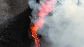 Volcano eruption, red hot burning lava erupts from ground, drone fly over active volcanic crater. Litli Hrutur Eruption 2023, Iceland. - Powered by Shutterstock - Get 15% off with code: PIKWIZARD15