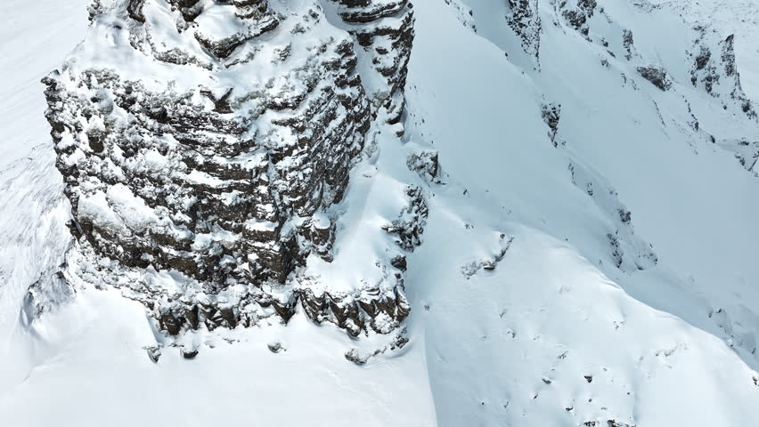 Steep peak covered in snow, Snowy mountain range, Aerial view nature landscape in Iceland, Epic panorama, Nature summit