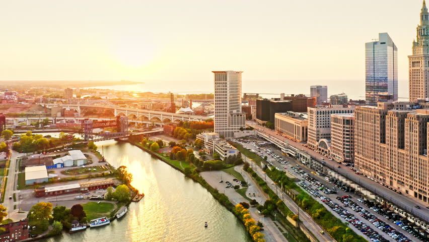 Aerial revealing shot of Cleveland, Ohio skyline at sunset. Cleveland is a major city in the U.S. state of Ohio and the county seat of Cuyahoga County.