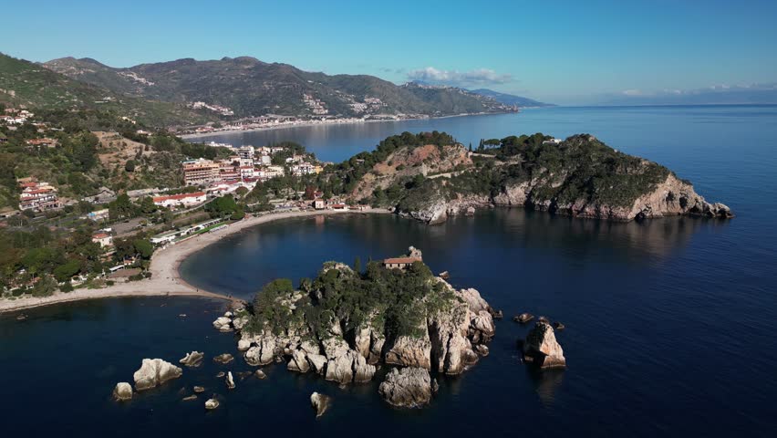 Drone Footage of Isola Bella Beach and Taormina, Sicily
A stunning aerial view of Isola Bella beach, the crystal-clear Mediterranean Sea, and the charming town of Taormina, Sicily. 