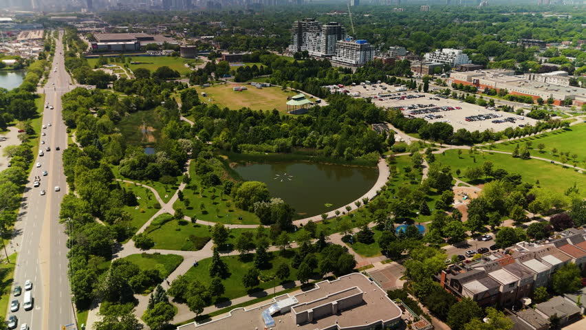 Stunning Aerial View of a Vibrant City Skyline Set Against a Beautiful Green Landscape and Flowing Waterway. Canada, Ontario, Toronto, Woodbine Beach
