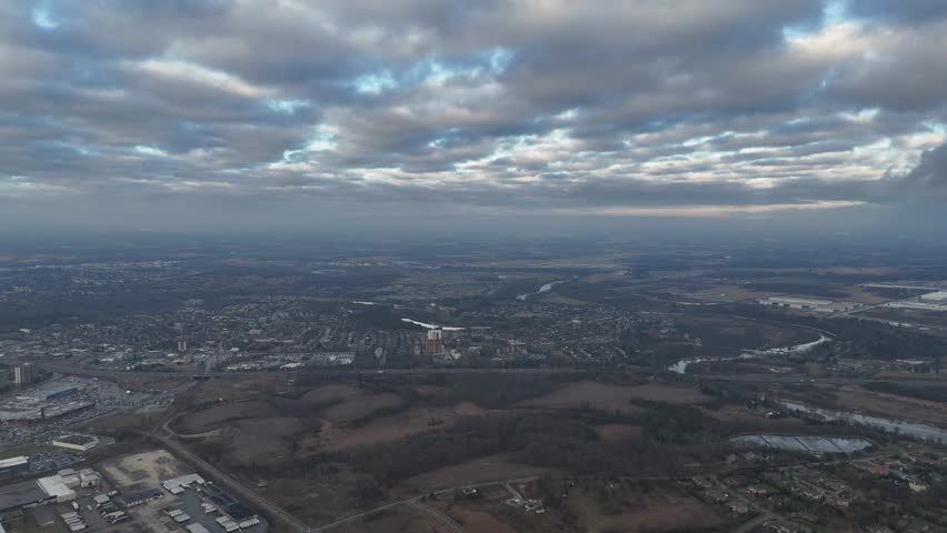 An aerial view of dramatic vibrant cloudy sky above the urban Kitchener, Ontario cityscape in Canada
