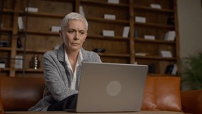 Senior woman stressed while using laptop - Powered by Shutterstock - Get 15% off with code: PIKWIZARD15