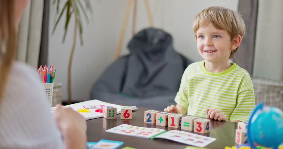 Happy child high-fiving during learning activity
