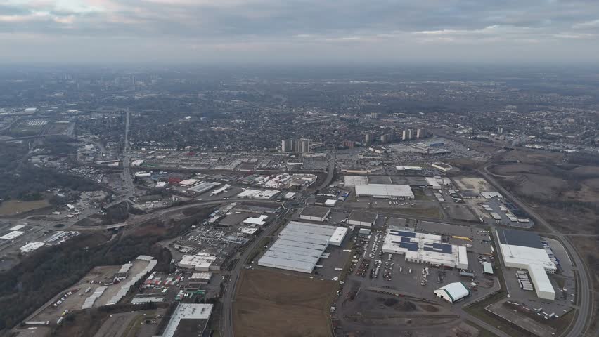 An aerial view of dramatic cloudy sky above the urban Kitchener, Ontario cityscape in Canada
