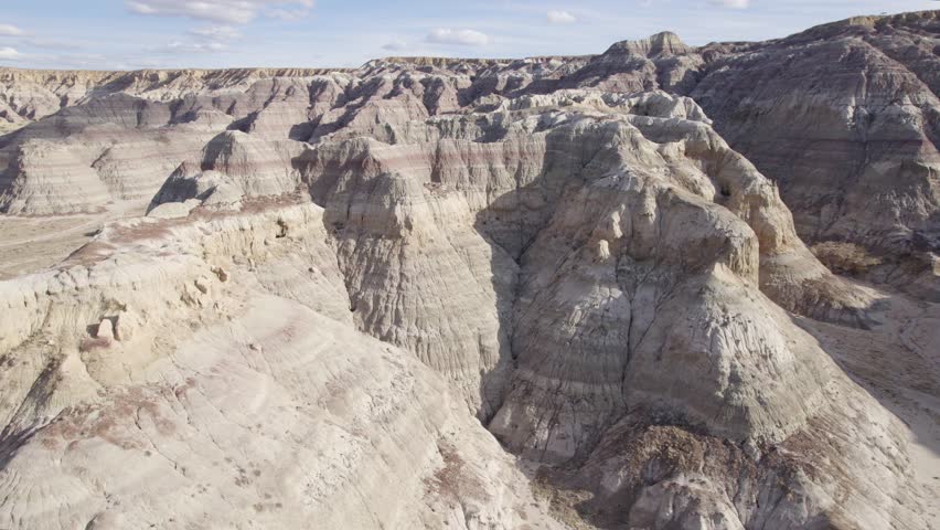 Canyon And Layered Rocky Formation at Rocky Bluff In Deserted Landscape Of New Mexico - Drone Shot
