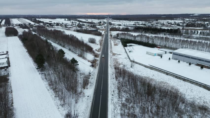 Scenic winter road through snowy nature