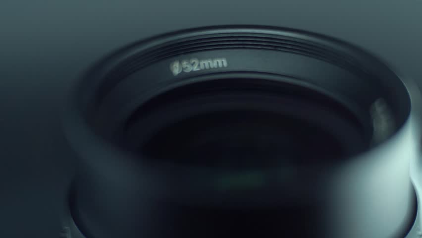 Low aperture camera cine optic lens flare Macro slow motion video tilt down movement, 120 fps