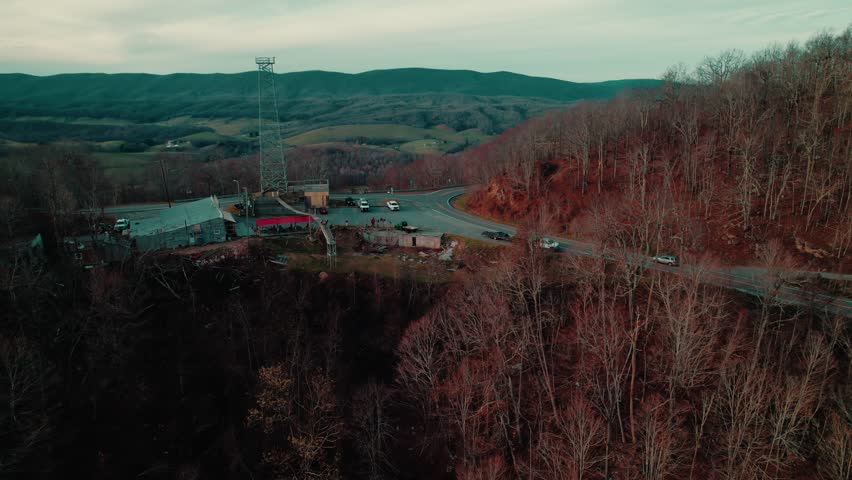 Aerial view of Big Walker Lookout with winding roads and Appalachian Mountains in the background.