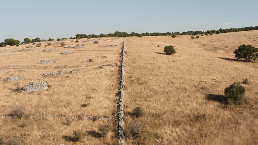 A party wall of an old breeding farm in the hills. Apulia, Italy