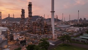 Oil Refinery plant at sunset. Gas Chemical Equipment Prodiction import export Concept, Crude Oil Refinery Plant Steel Pump Pipe line and Chimney and Cooling tower, Chemical Petrochemical - Powered by Shutterstock - Get 15% off with code: PIKWIZARD15