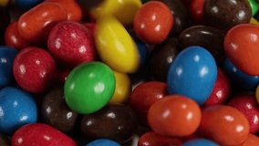 Multicoloured button-shaped chocolates. Concept: Sweets, chocolate, candies. - Powered by Shutterstock - Get 15% off with code: PIKWIZARD15