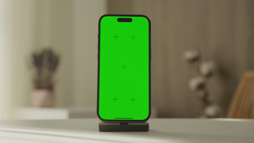 Smartphone on Dock with Green Screen Display
