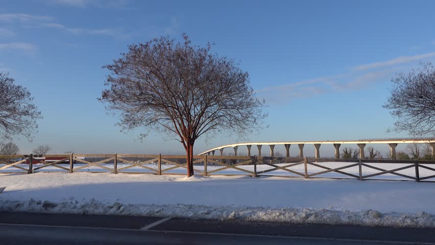 Solomons, Maryland, USA A view of the Gov. Thomas Johnson Bridge in the snow in winter on the Patuxent River. 