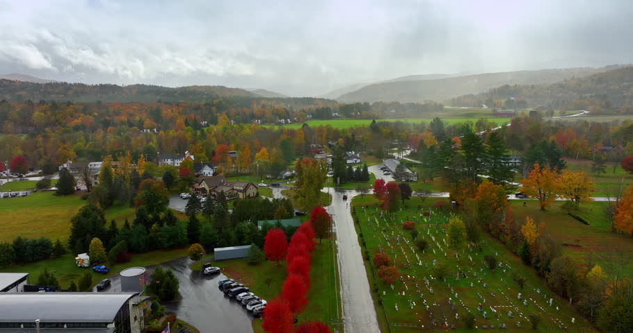 Scenic view of colorful Vermont, New England, USA. Drone footage above the picturesque city on wet autumn day.