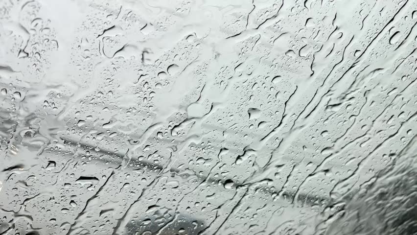 Rainwater that falls on the car glass