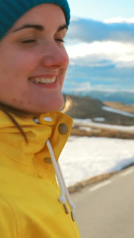 Aurlandsfjellet, Norway. Young Happy Woman Tourist Traveler Photographer Taking Pictures Photos Of Aurlandsfjellet Scenic Route Road. Norwegian Landmark And Popular Destination.