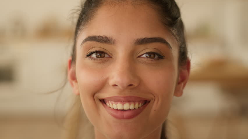 Portrait happy toothy smiling joyful Arabian woman Indian girl female lady smile healthy dental oral health medicine whitening teeth client carefree cheerful positive satisfied fun face emotion joy