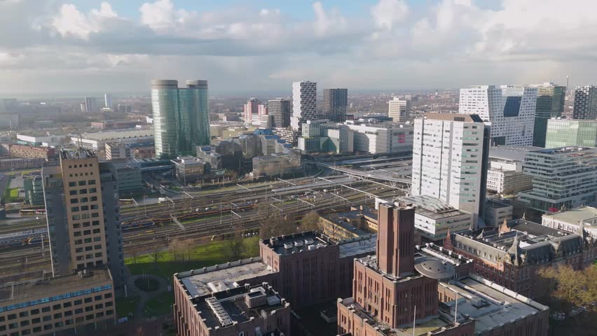 This aerial drone video shows the central station with the railway tracks in the city of Utrecht, the Netherlands.