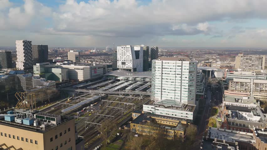 This aerial drone video shows the central station with the railway tracks in the city of Utrecht, the Netherlands.