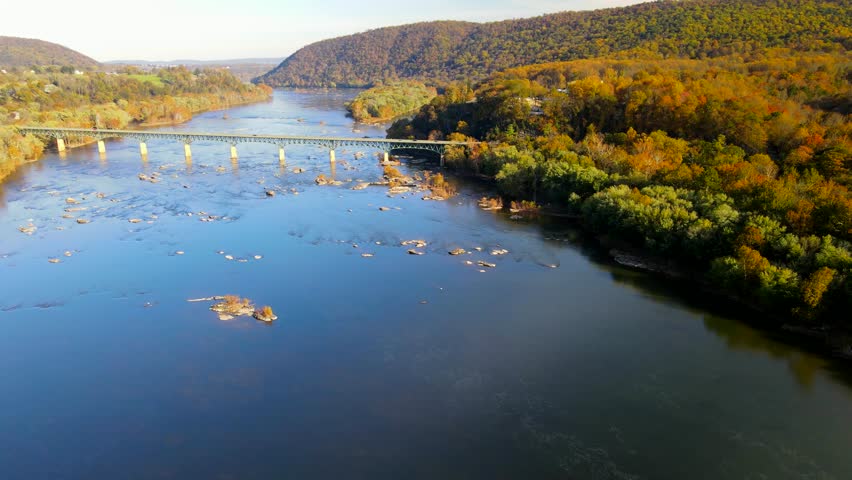 Autumn landscape overlooking the Potomac River and highway bridge from a drone