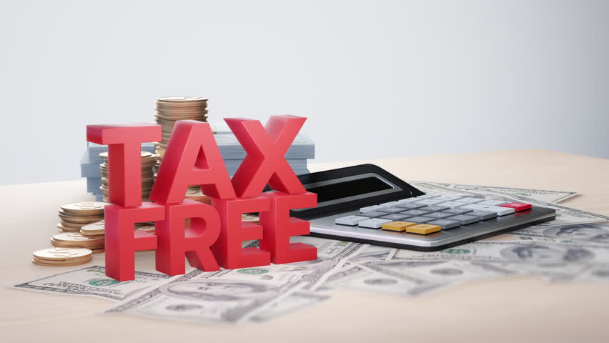 Red "Tax-Free" text surrounded by cash, stacked coins, and a calculator, representing tax exemptions, savings, or financial planning.