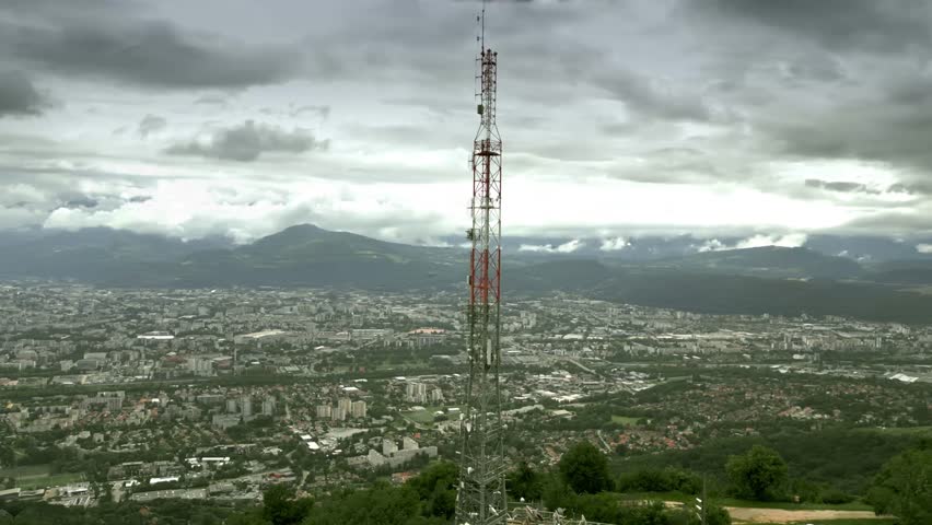 FPV drone aerial shot of the modern 5G telecommunication tower close to Grenoble, France