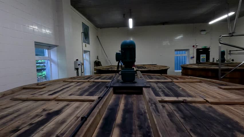 Wooden tanks in a distillery setting