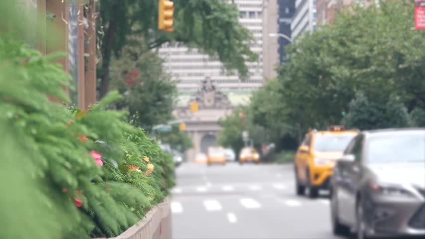 New York City Park Avenue. Grand Central Terminal railway station on 42 street. Manhattan Midtown. Yellow taxi cab in NYC, USA. American urban road car traffic, transport in United States. Defocused.