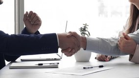 Couple signing contract, shaking hands advisor or company manager, feel satisfied with services, bought house, getting mortgage, finalize meeting in bank office, close-up view. Making commercial deal - Powered by Shutterstock - Get 15% off with code: PIKWIZARD15