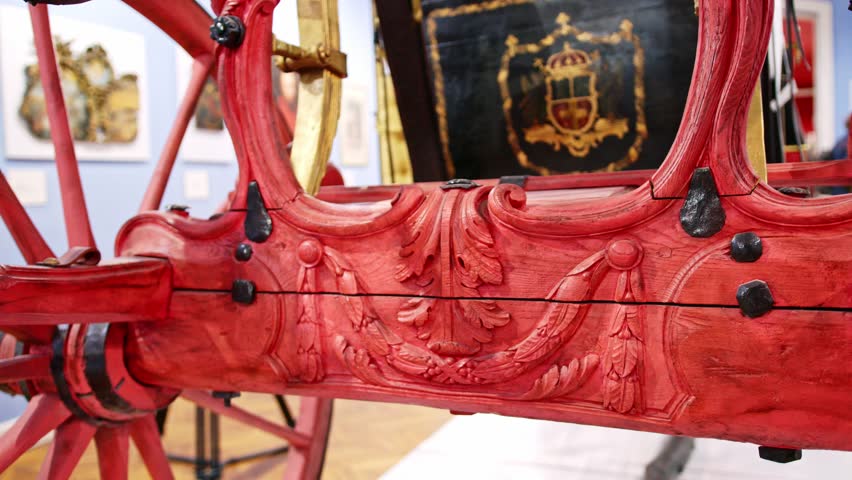 Detailed craftsmanship of a historical cart from a museum exhibit showcasing traditional transport