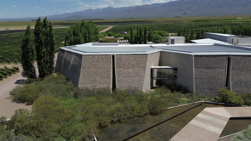 Aerial shots of the world famous wineries in Mendoza, Argentina. Its vast plantations at the foot of the andes mountain range along with its internationally awarded architecture.