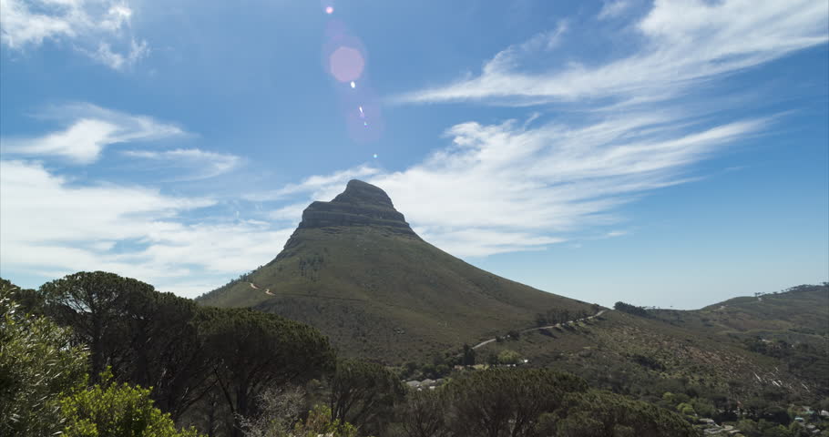 A static Timelapse with clouds moving quickly behind Lions Head, as viewed from the base of Table Mountain.