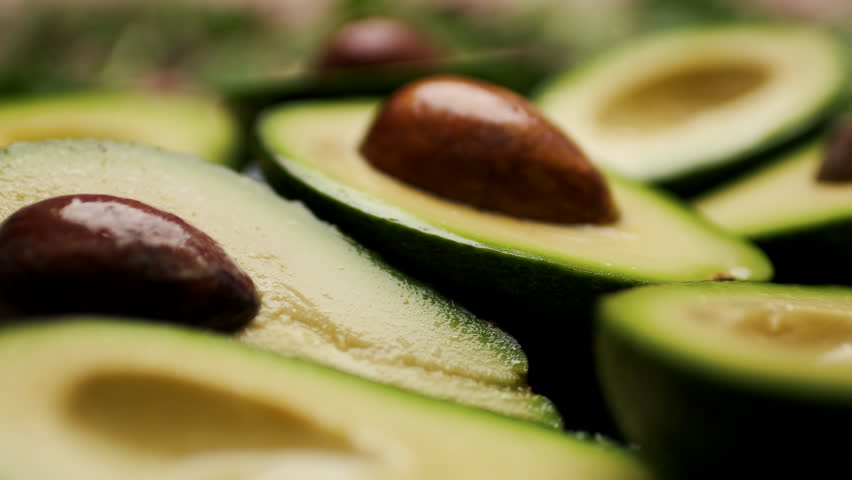 Fresh Avocado Halves on a Plate, Close Up 