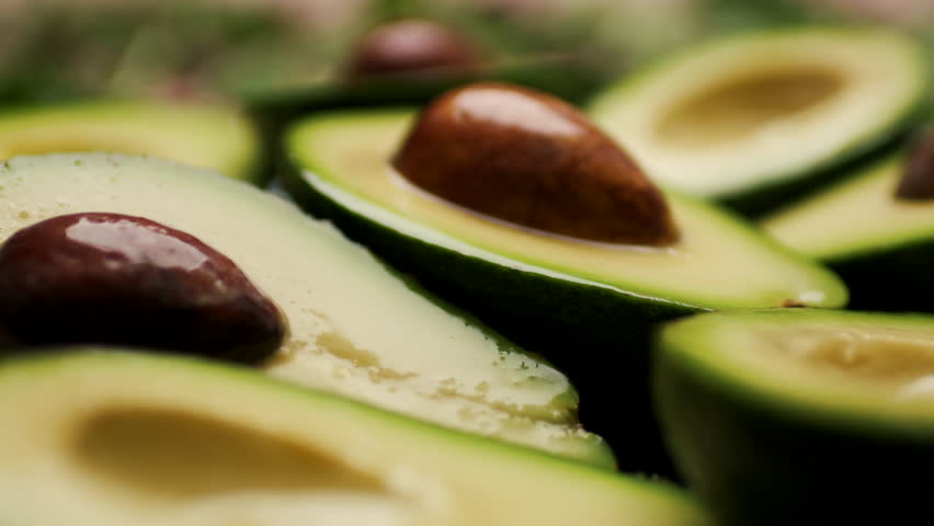 Fresh Avocado Halves on a Plate, Close Up 