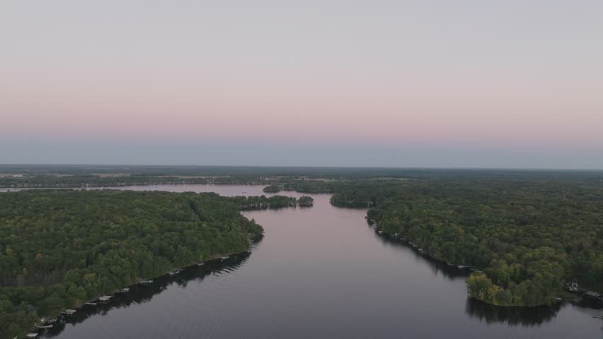 A scenic aerial view of Balsam Lake, Wisconsin, at twilight with serene waters.