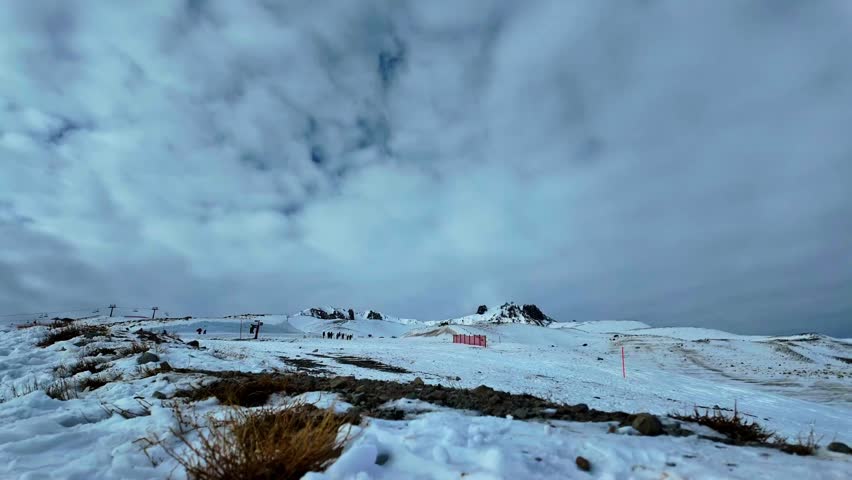 A view of the peak of Erciyes, the largest mountain in Turkey, from the tabby gate. Clouds and Fast motion.