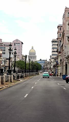 Traffic on central crossroad of Havana, people on the street of Havana, the old district of the capital of Cuba