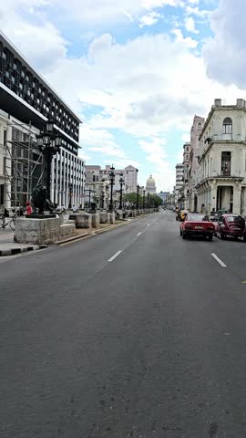 Traffic on central crossroad of Havana, people on the street of Havana, the old district of the capital of Cuba