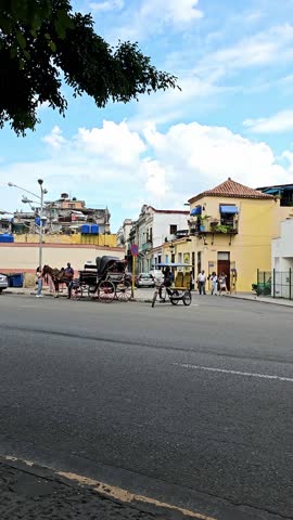 Traffic on central crossroad of Havana, people on the street of Havana, the old district of the capital of Cuba