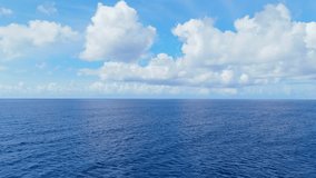 Gentle aerial dolly of vast blue ocean under a clear sky, calm and peaceful sea surface - Powered by Shutterstock - Get 15% off with code: PIKWIZARD15