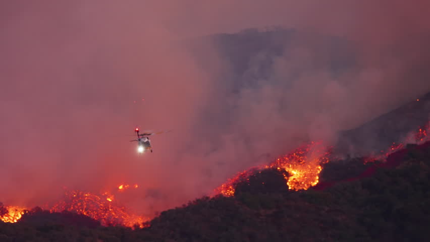 A heroic helicopter battles a massive fire in Malibu, Los Angeles, showcasing the dedication of all those fighting against this devastating disaster and its consequences. January 7, 8, 9, 2025