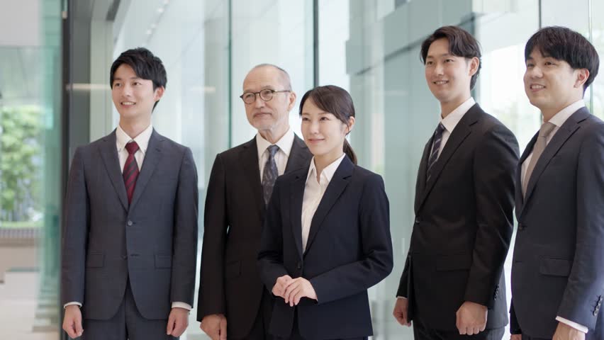A smiling business person posing in a fist