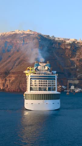 Greece Islands, cruise ship docked near Santorini island on a cruise vacation in Mediterranean,