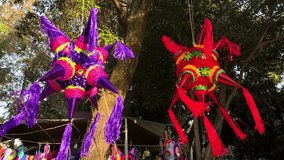 Colorful pinatas hanging fromch tree, party celebration decor - Powered by Shutterstock - Get 15% off with code: PIKWIZARD15