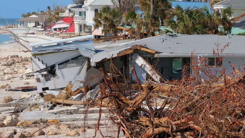 Destroyed houses on ocean shore after hurricane Milton landfall. Natural disaster consequences on Manasota Key, Florida. Storm surge severe damage.