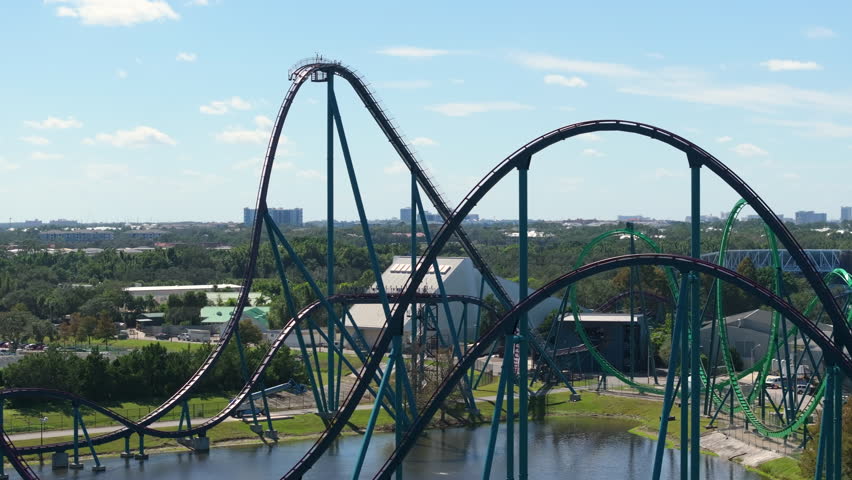 Excited fun of enjoying thrilling rollercoaster at amusement park in Orlando, Florida.