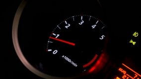 Close up of car speed meter. Footage. Interior of a modern car, dashboard with an engine speed dial and moving red arrow. - Powered by Shutterstock - Get 15% off with code: PIKWIZARD15