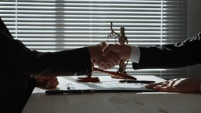 Corrupt businessmen making illegal agreement, exchanging money through secret handshake inside lawyer office with professional attire and legal backdrop - Powered by Shutterstock - Get 15% off with code: PIKWIZARD15